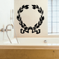 Black laurel wreath wall decal with curled banner