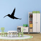 Black hummingbird flying wall decal with outstretched wings and long tail