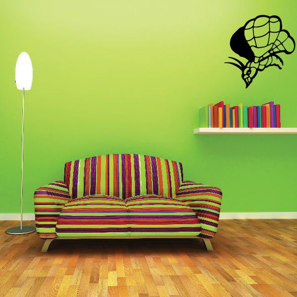 Moth wall decal with dark outline and green wings, flying above shelves