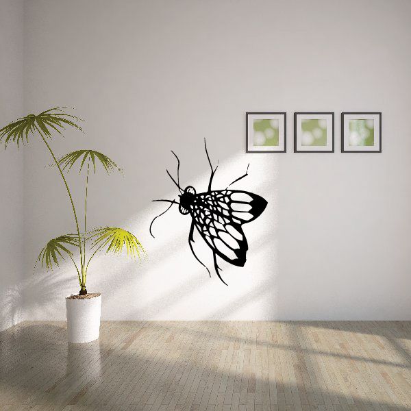 Black fly wall decal with intricate wings, designed to look hidden in leaves