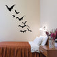 Flying bat wall decal set with multiple black bats in flight
