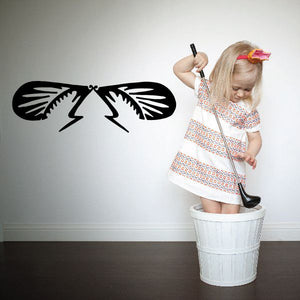 Flying beetle wall decal with black winged insect silhouette