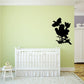 Black quail flock wall decal with birds in flight above grass