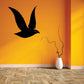 Flying fowl decal with black flying bird silhouette on a wall