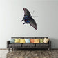 Flying butterfly wall decal with dark blue and purple wings and moonlit highlights