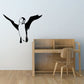 Flying puffin wall decal with black wings and white body