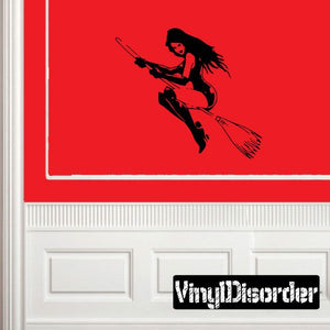 Black flying witch without hat decal, broom-holding silhouette in dynamic pose