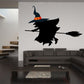 Flying witch wall decal, black die-cut silhouette with orange buckle and broom