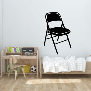 Fold-out chair with black fabric seat and back, white metal legs