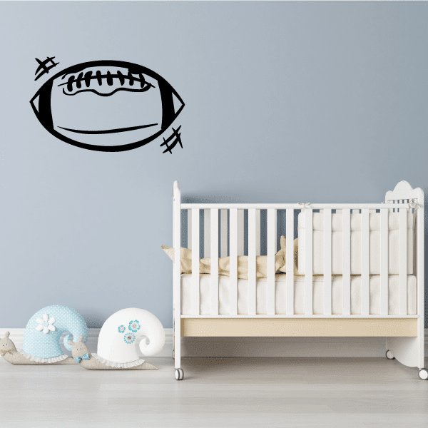 Football vinyl wall decal with outlined football and stitching details