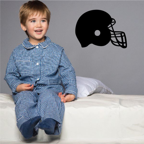 Black football helmet wall decal with faceguard design
