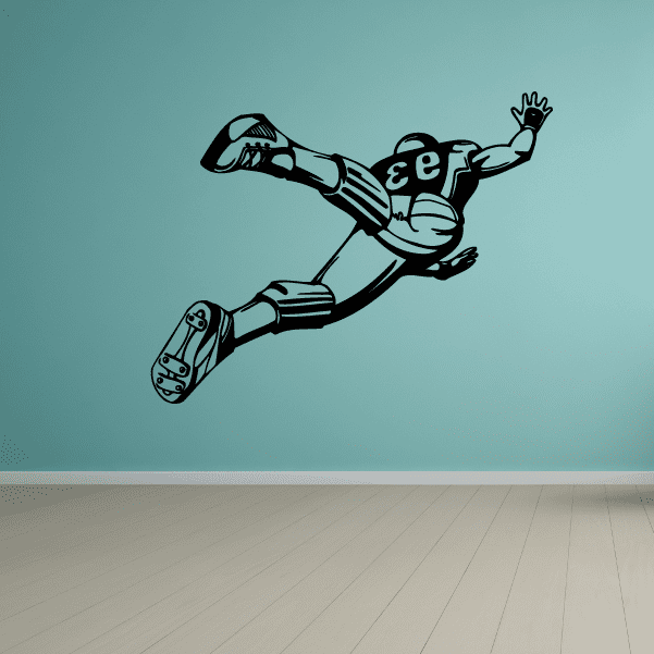 Football player wall decal, vinyl sticker of a stylized player reaching forward with one arm up