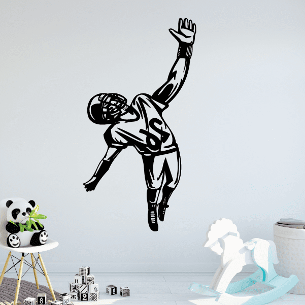 Black football player wall decal with ball held under one arm, arm raised.
