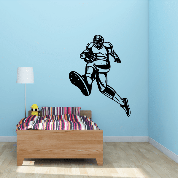 Football player wall decal in black and white vinyl, running pose