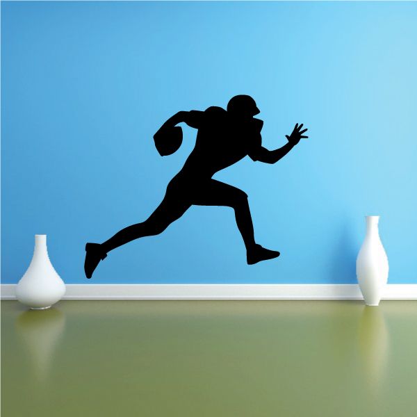 Football player wall decal, black vinyl silhouette in action pose
