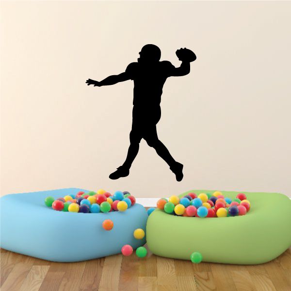 Football player wall decal, black vinyl silhouette of running football athlete