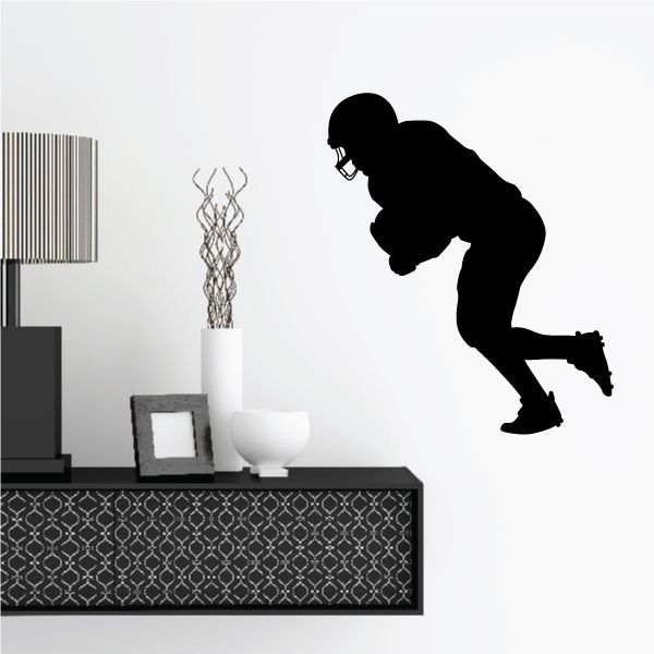 Football player wall decal, black vinyl silhouette of kicking player