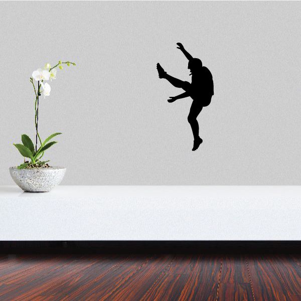 Football player wall decal, black vinyl silhouette of kicking player