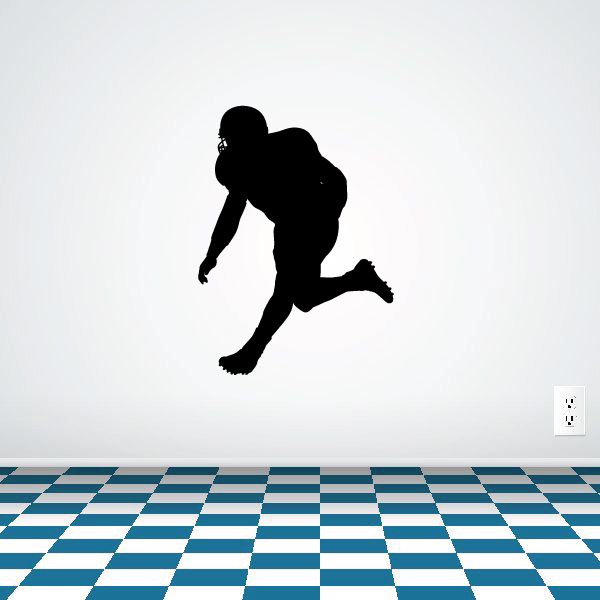 Football player wall decal, black vinyl silhouette kicking a ball