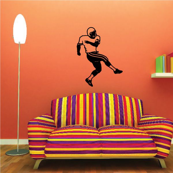 Football player vinyl wall decal with black running silhouette
