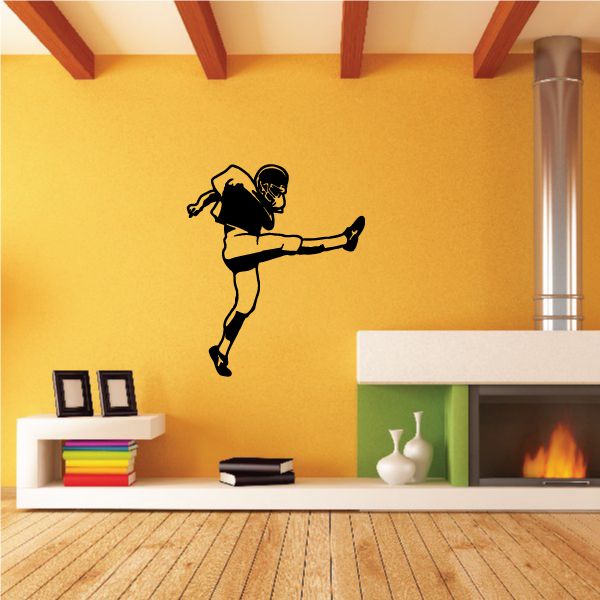 Football wall decal vinyl sticker of a black football player silhouette in midair