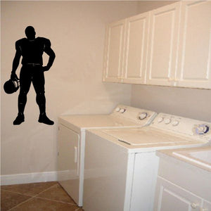 Black football player vinyl wall decal with raised ball pose