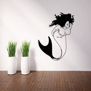 Black mermaid swimming decal with curled forked tail and stylized hair