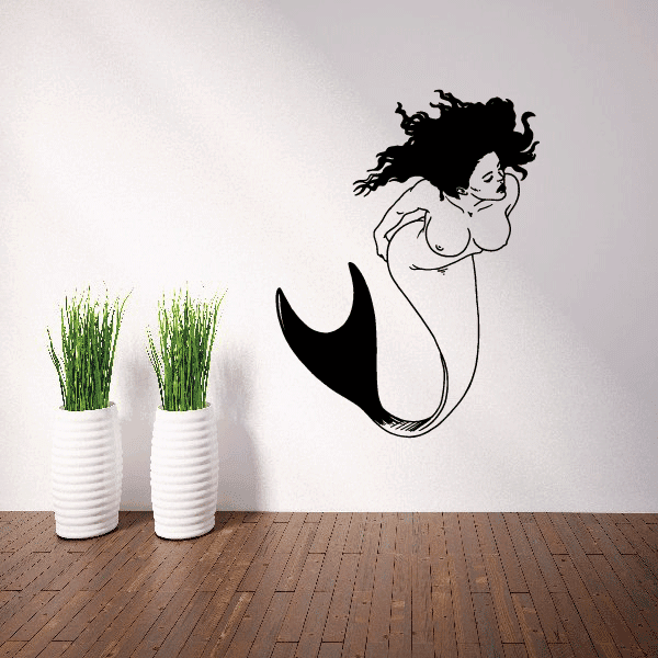 Black mermaid swimming decal with curled forked tail and stylized hair
