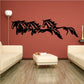 Four horses running decal, black silhouette across a wall