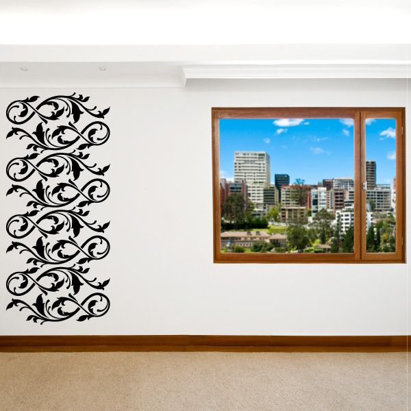 Ornate black floral wall decal with scrolling vine flourish