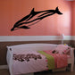 Dolphin wall decal in black, stylized jumping design