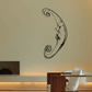 Crescent moon wall decal with cat face and swirling ornament lines, black outline.
