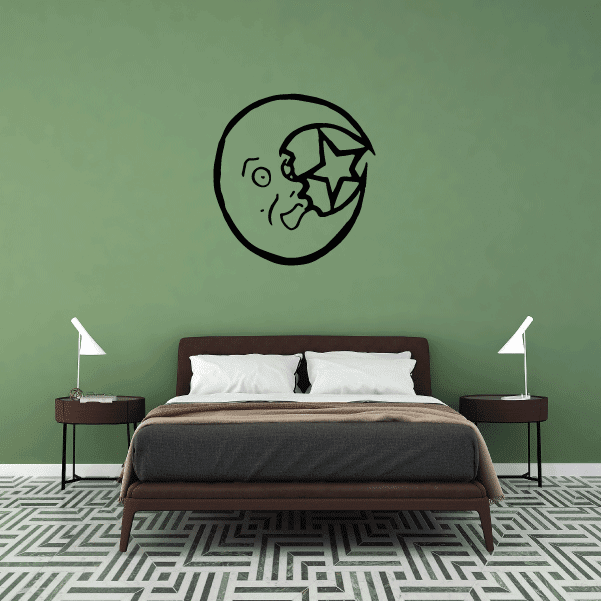 Black moon decal with playful face and star accents in a circular outline