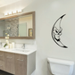Black crescent moon wall decal with a horned bat face