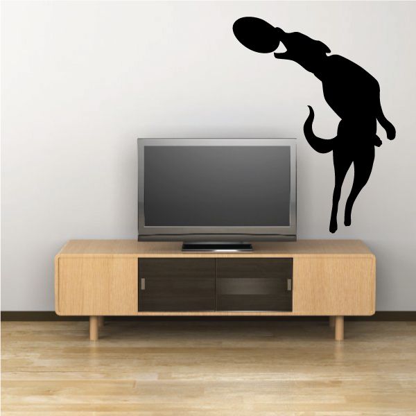 Catching dog frisbee decal in black vinyl silhouette