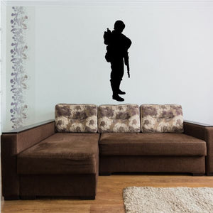 Black soldier silhouette decal, standing with gear backpack and rifle slung