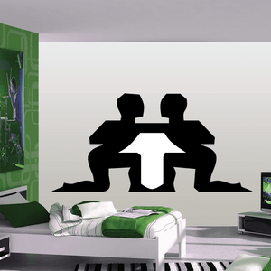 Black simple figure wall decal with two seated silhouettes, centered on a wall