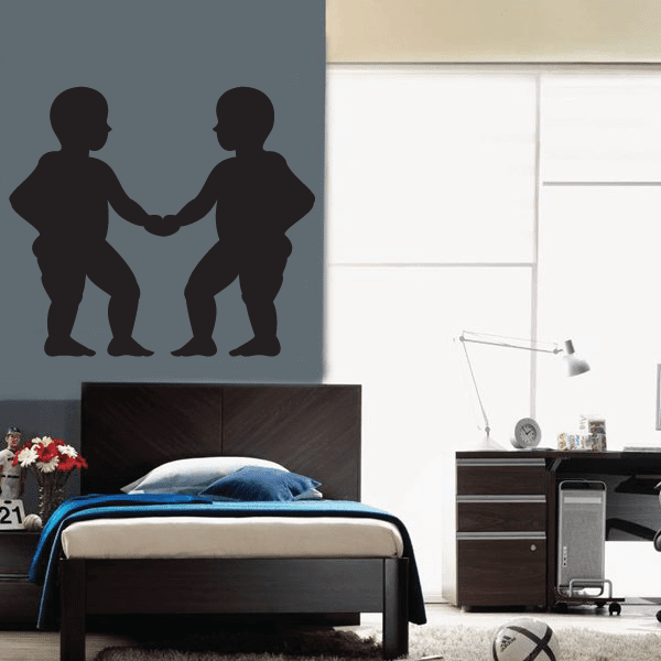 Gemini figures wall decal of two silhouette people facing each other, hands held