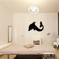 Gentle dolphin wall decal in black, playful jumping silhouette