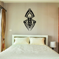Black geometric spider wall decal with ornate symmetrical design