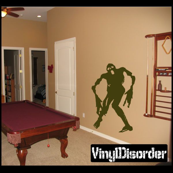 Green zombie silhouette wall decal in a spooky pose, removable vinyl style
