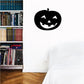 Black jack-o'-lantern face decal with triangular eyes and jagged mouth