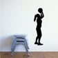 Black silhouette girl basketball wall decal, standing pose holding a ball