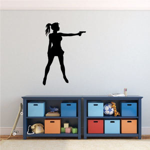 Black silhouette girl shooting handgun wall decal, side profile with raised weapon