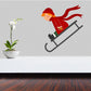 Girl sledding die-cut decal of a child in red hat on a gray sled