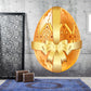 Gold decorative egg sticker with golden bow and geometric patterns
