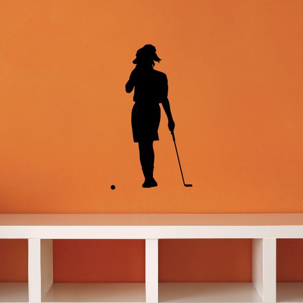 Golf wall decal: black golfer silhouette holding a club with a small golf ball