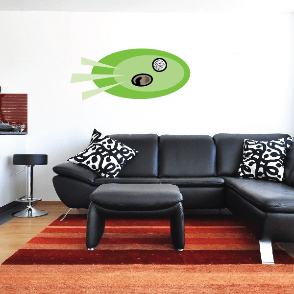 Golf wall decal sticker: green oval with black golf ball inside, die-cut design.