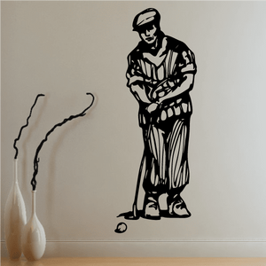 Golfer wall decal, black vinyl silhouette of golfer standing with hands clasped.