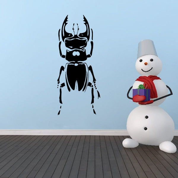 Beetle character decal with black armored body and horned head